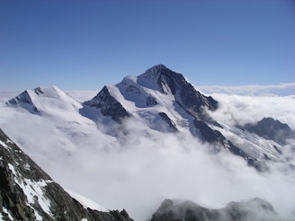 Finsteraarhorn showing N Ridge in profile on L of summit.jpg